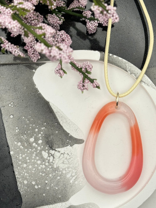 Oblong pink and coral pendant
