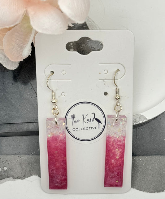 Pink dangle earrings with glitter