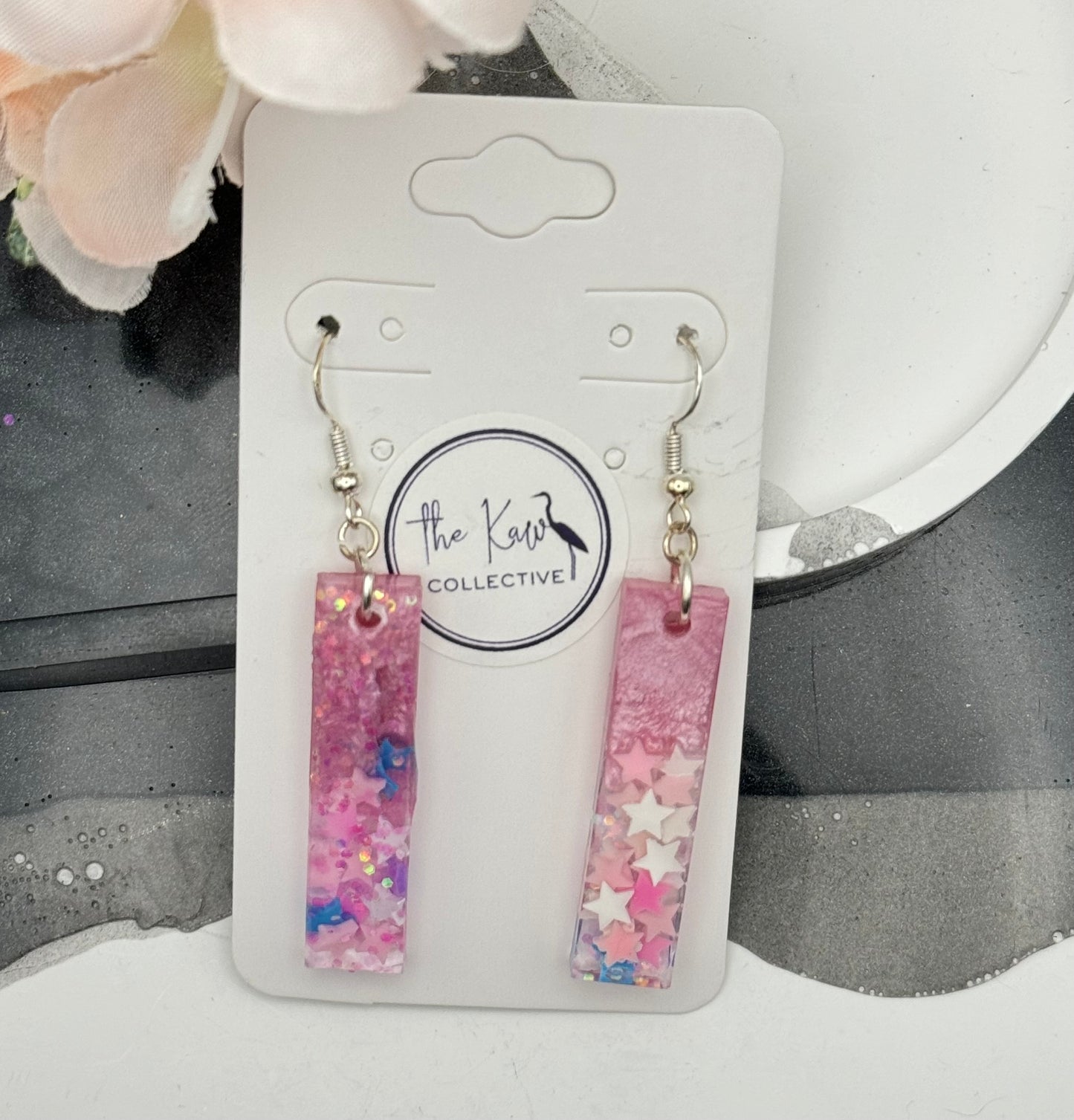 Pink dangle earrings with stars