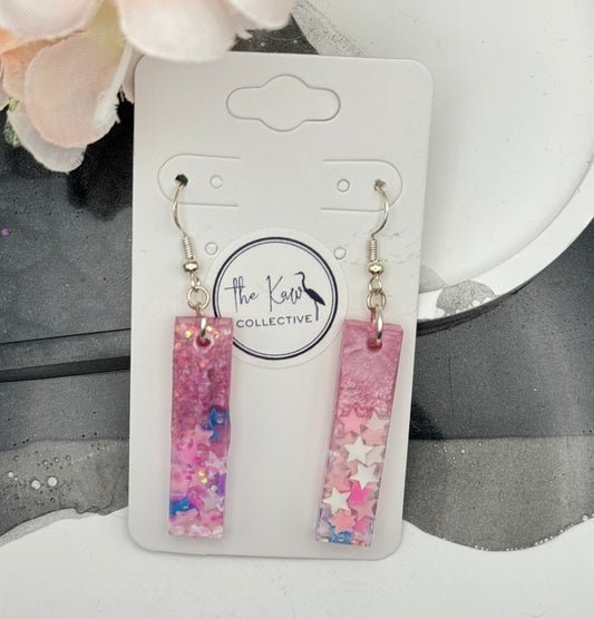 Pink dangle earrings with stars
