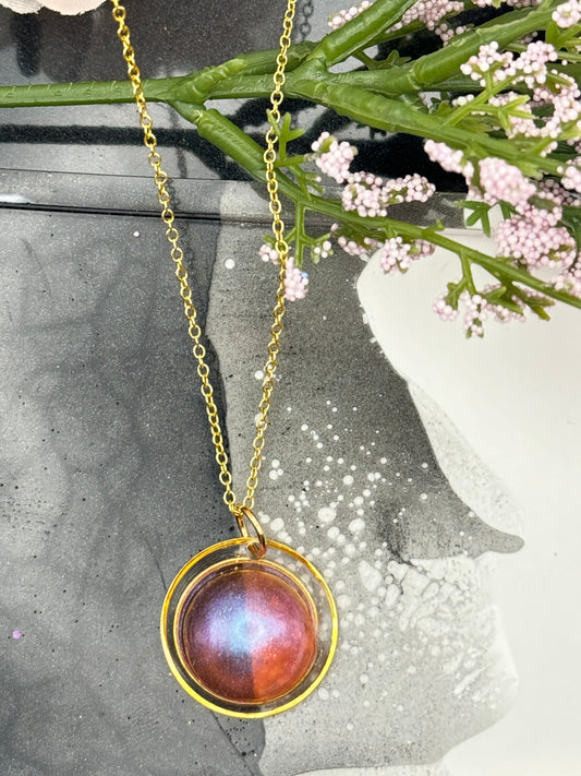 Pink and gold round pendant