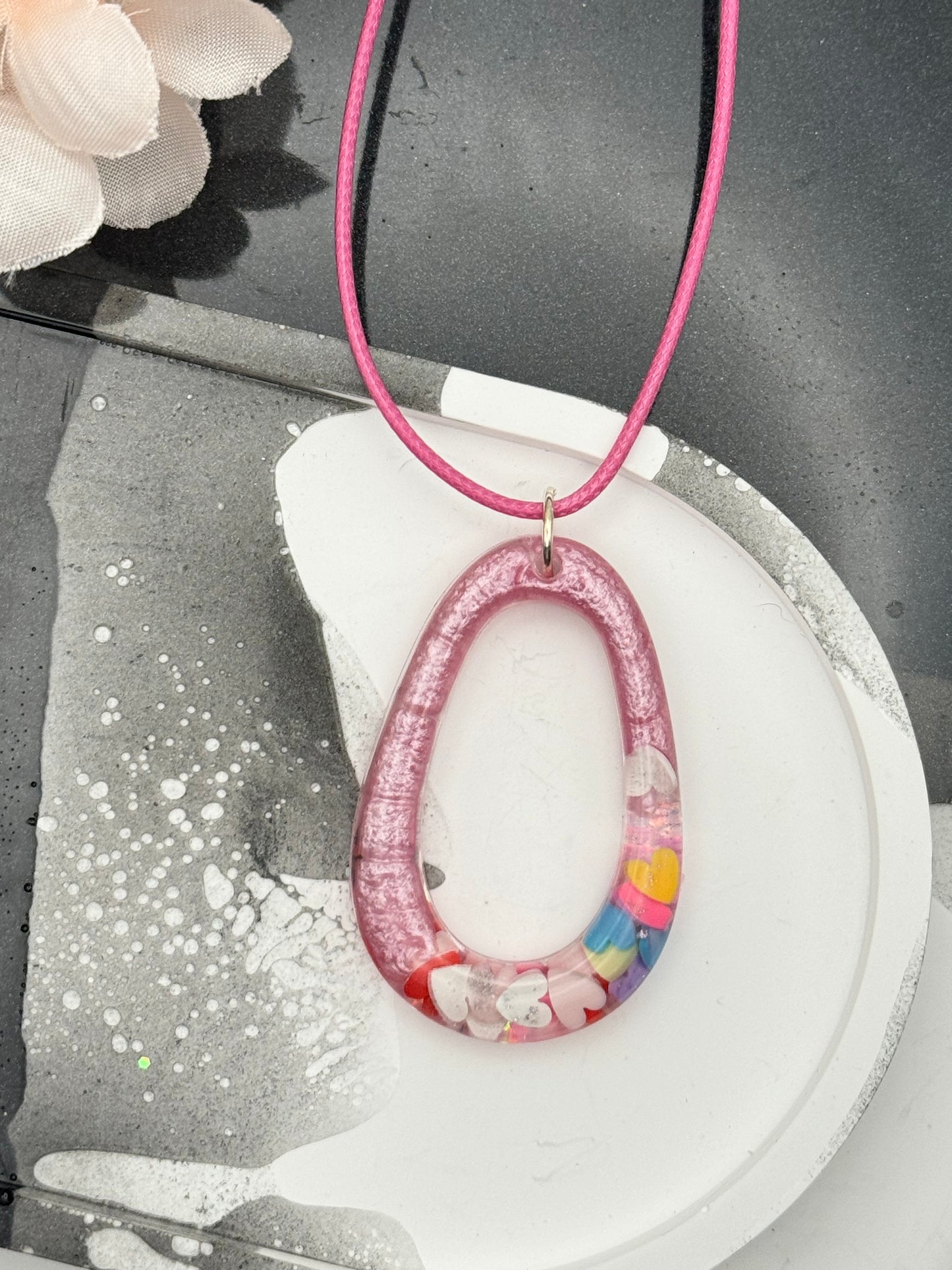 Pink Oblong necklace with multi-colored hearts