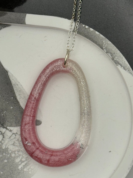 Pink oblong pendant with glitter and silver flakes